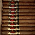 God of Fire KKP Special Reserve Toro Extra 54 in the open Macassar ebony travel humidor
