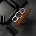 Les Fines Lames La Guillotine Rotor chrome with a cigar and case