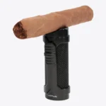 Lotus Armor Triple Torch Lighter holding a cigar on its rest cap