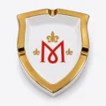 Montecristo M Collection shield-shaped ceramic ashtray with a gold rim and red M