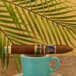 Trinidad Espiritu Miami Edition Belicoso resting on a coffee cup