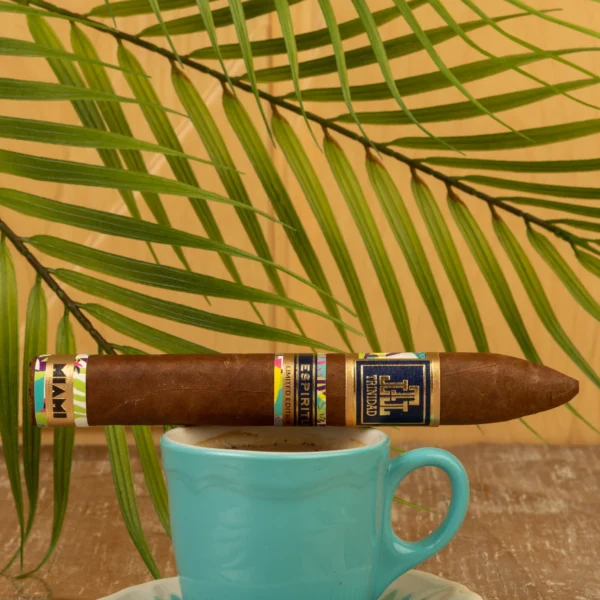 Trinidad Espiritu Miami Edition Belicoso resting on a coffee cup