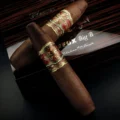 Arturo Fuente Opus X Big B cigar on its box, 6 x 74 perfecto