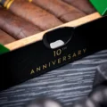 Box front stamped 10th Anniversary with maduro cigars inside