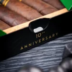 Box front stamped 10th Anniversary with maduro cigars inside