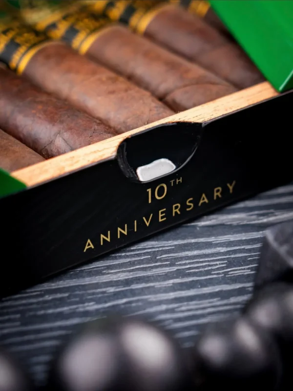 Box front stamped 10th Anniversary with maduro cigars inside