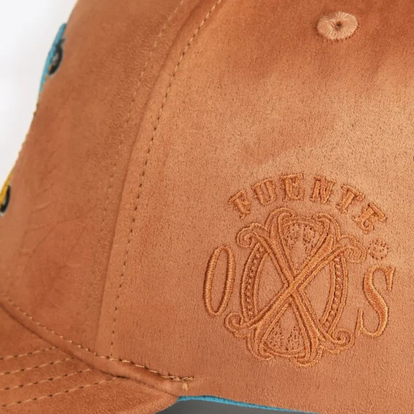 Opus X Society Snapback Hat Suede Earth Limited Edition 7 Close up of the debossed Fuente OXS monogram on the side of the Earth snapback hat