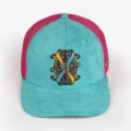 Opus X Society Miami Vice trucker hat, front view in teal suede with the Opus X Society crest patch