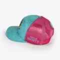 Opus X Society Miami Vice trucker hat, side view with the magenta Opus X Society patch